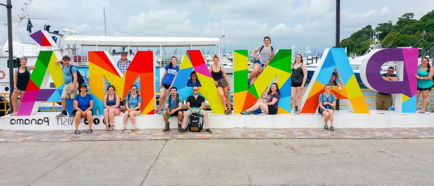 UNE students near Panama Sign